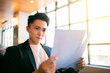© Tom Wang - young Business man  Working and study In Coffee Shop