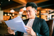 © Tom Wang - young Business man  Working and study In Coffee Shop