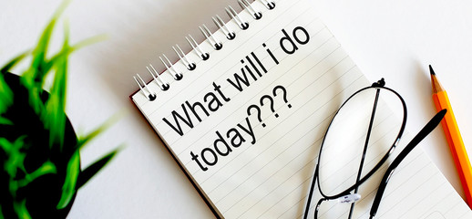 Poster - Notebook with glasses and pencil on wooden table, business concept What will i do today?