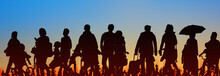 Sihouette Of Group Of People Sunset Sky Background  -