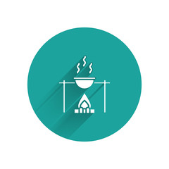 Sticker - White Campfire and pot icon isolated with long shadow. Fire camping cooking in cauldron on firewood and flame. Green circle button. Vector