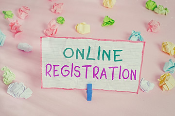 Fototapete - Text sign showing Online Registration. Business photo text System for subscribing or registering via the Internet Colored crumpled papers empty reminder pink floor background clothespin