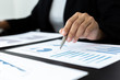 © Puwasit Inyavileart - Head of marketing has analyzed the financial income graph of the company in order to develop the structure of the company to be ready for the economy in the future. Financial results analysis concept.