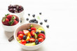 © Tawan - Healthy foods  Concept ,blueberry  strawberry apple  with salad  in  bowl on white wood background