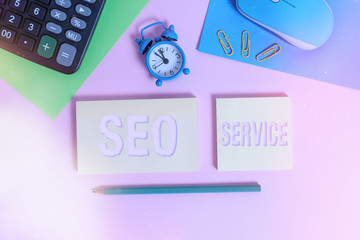 Poster - Handwriting text Seo Service. Conceptual photo techniques and procedures to increase the website visibility Wire mouse clock calculator notepads marker sheets clips color background