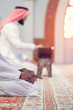 © FS-Stock - Two religious muslim man praying together inside the mosque