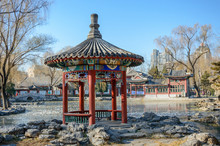 Chinese Gazebo On The Banks Of A Pond In A City Park.