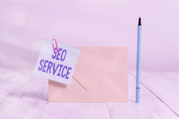 Poster - Conceptual hand writing showing Seo Service. Concept meaning techniques and procedures to increase the website visibility Standing envelope sticky note marker old wooden vintage background