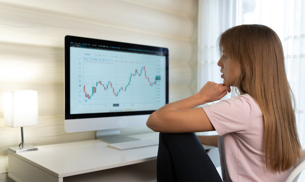 girl works at the computer in a homely atmosphere. Stay at home