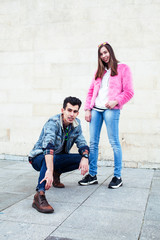 young pretty couple of student boy and girl together outside happy smiling, lifestyle people concept