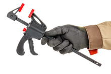 Quick Release Clamp In Worker Hand In Black Protective Glove And Brown Uniform Isolated On White Background