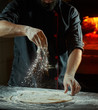 © Sabor Caribe - Close up chef making italian pizza cooked woodfired oven