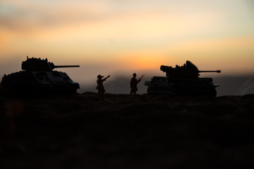 War Concept. Military silhouettes fighting scene on war fog sky background, World War Soldiers Silhouette Below Cloudy Skyline At sunset.