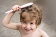 © Tverdokhlib - Hairstyle for children. The boy knows how to comb his hair.