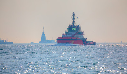 Wall Mural - Tugboat sailing in the sea. Tugboat making maneuvers at Istanbul Port - Istanbul, Turkey