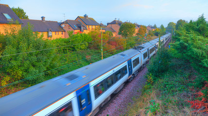 Wall Mural - London commuter train in motion -   Located on West Anglia Main Line serving the small town of Sawbridgeworth in Hertfordshire, England