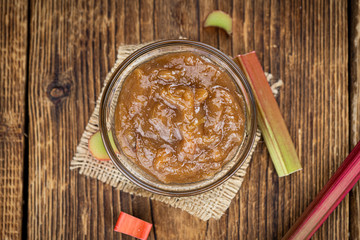 Canvas Print - Rhubarb Jam on an old wooden table (close up shot; selective focus)