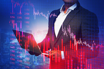 Poster - Trader with laptop in night city, falling graph