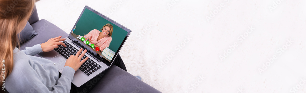 Girl Video Conferencing With Teacher On Laptop - obrazy, fototapety, plakaty 