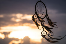 Close-up Of Dreamcatcher Against Sky During Sunset