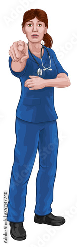 Fotomural A woman nurse or doctor in surgical or hospital scrubs pointing in a your country needs or wants you gesture