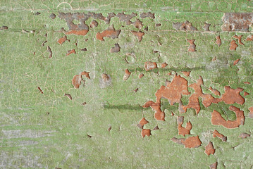 Wall Mural - Texture of old wood with cracked paint of green color