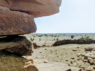 Stone wall ruins over desert