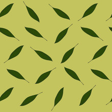 Seamless Pattern Of Green Oval Leaves On A Beige Background. Leaves In A Chaotic Pattern On A Light Background