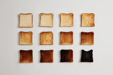 Pieces Of Bread Browned As Result Of Toasting. Delicious Crust Tender Slices Of Bread Prepared In Toaster Which May Be Served With Spreads Or Toppings, Isolated On White Background. Stages Of Burning.