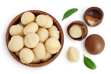 Poster - macadamia nuts in wooden bowl isolated on white background with clipping path and full depth of field. Top view. Flat lay.