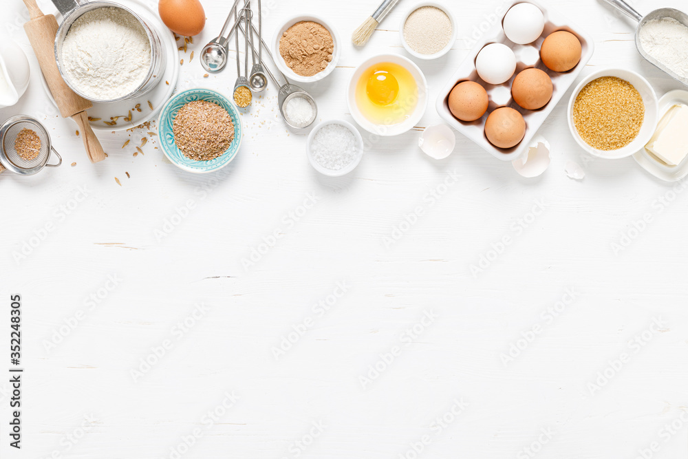 Baking homemade bread on white kitchen worktop with ingredients for cooking, culinary background, copy space, overhead view - obrazy, fototapety, plakaty 