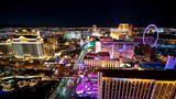 Fototapeta Las - aerial panorama of Las Vegas Strip by night. Scenic flight over High Roller, Caesars Palace, The Paris, Planet Hollywood, Bellagio Casino and Hotel