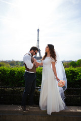 newly married couple in Paris near the Eiffel Tower