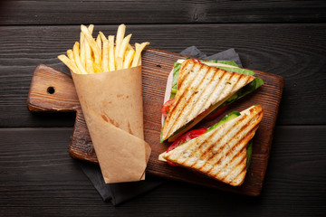 Club sandwich and potato fries