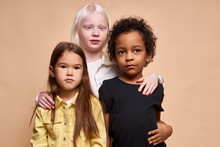 Adorable Kids Of Diverse Nationalities And Skin Colors Stand Together Posing At Camera, Group Of Beautiful Children, Albino Girl Hug Friends. Albinism, People Diversity, Children Concept