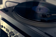 © Golovchenko Dmytro - The vinyl needle reads the music from the record on a vinyl player. Old school. musical atmosphere. Old player and analog music. subject photo. the song plays