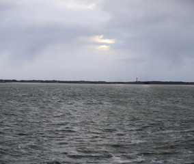 view of amrum north frisian island from ferry with north sea