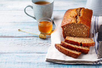 Wall Mural - Healthy vegan oat and banana loaf bread, cake. Wooden background. Copy space.