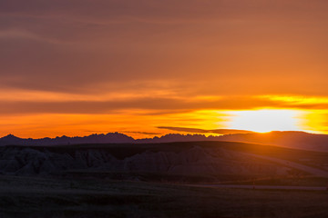 Wall Mural - landscape view of a colorful sunset in badlands national park in south dakota).