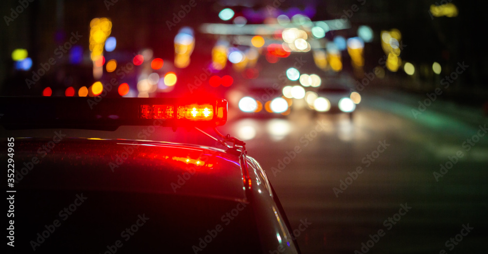 police car lights in night city with selective focus and bokeh Stock ...
