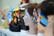 © pwk16 - beautiful multi-colored wigs stand on a shelf