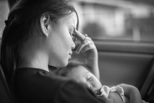 Depressed Mother Holding Her Baby, Tired And Stressed. Postpartum.
