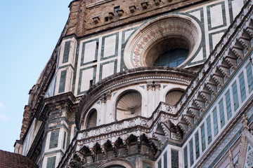 Wall Mural - Exterior / facade of the Cathedral of Santa Maria del Fiore in Florence, Italy. Closer look onto a part of the dome with round window