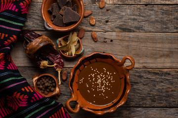 Wall Mural - Mexican mole sauce on wooden background
