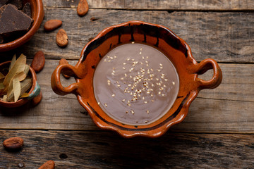 Wall Mural - Mexican mole sauce on wooden background