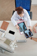 © DragonImages - Doctor checking chest x-rays of patient with pneumonia, view from above