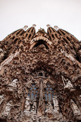 Wall Mural - Carved stone sculpture grand facade of La Sagrada Familia Basilica church in Barcelona. Spain