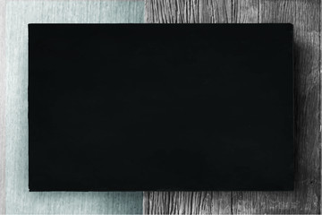 Wall Mural - Black frame on wooden background vector