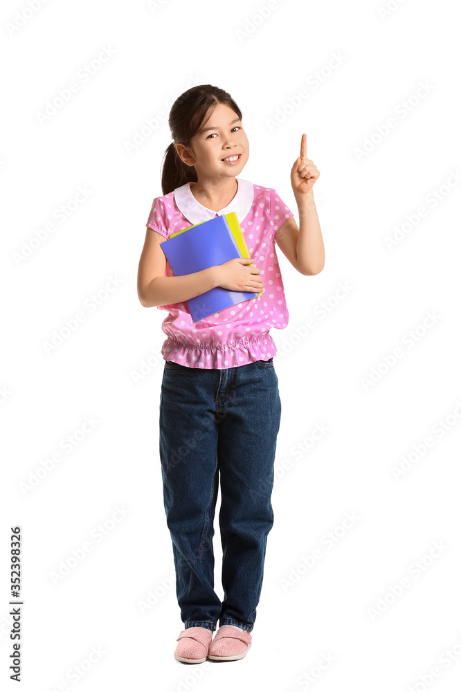 Little pupil with raised index finger on white background