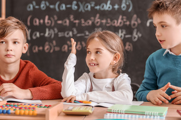 children during math lesson in classroom